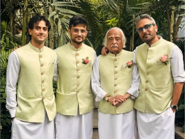 Anwar Maqsood in sherwani along with his three sons