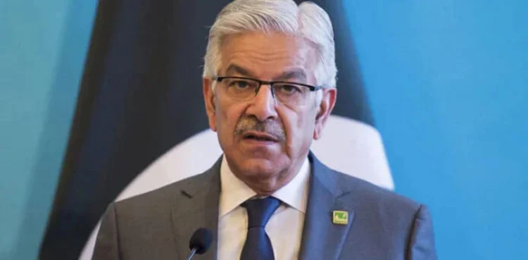 Khawaja Asif sitting on chair