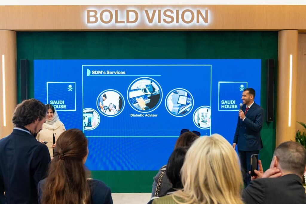 Researcher lecturing on wall screen