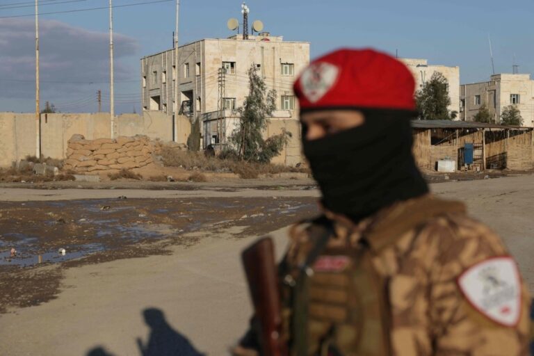 Kurdish soldier positioning on road