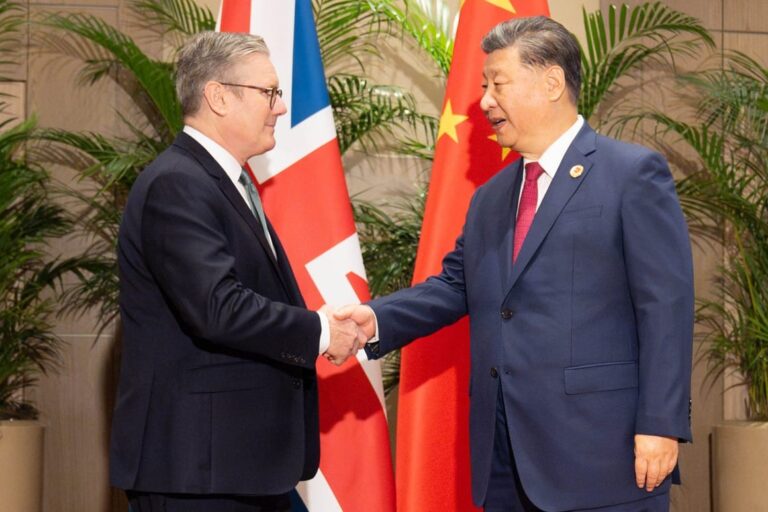 UK Prime Minister Sir Keir Starmer shaking hand with Chinese President Xi Jinping