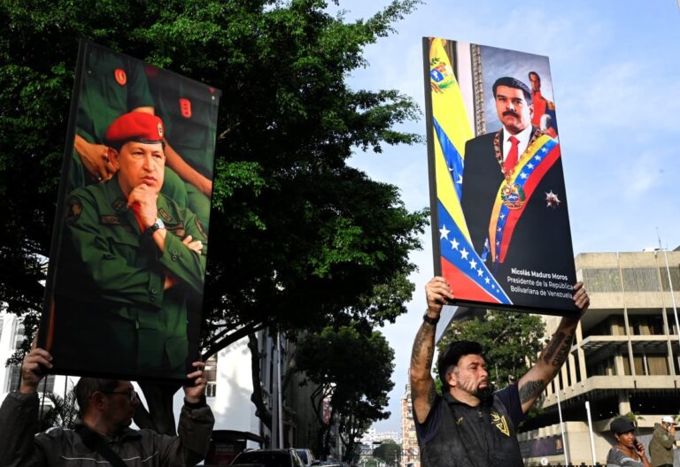 people carrying banners of venezuela presidents