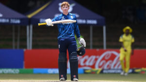 A cricket player holding bat